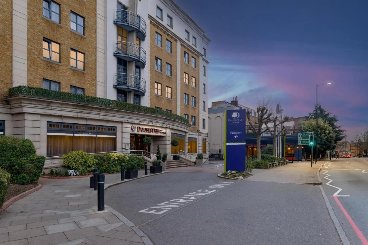 an empty street in front of a tall building at DoubleTree by Hilton London Angel Kings Cross in London