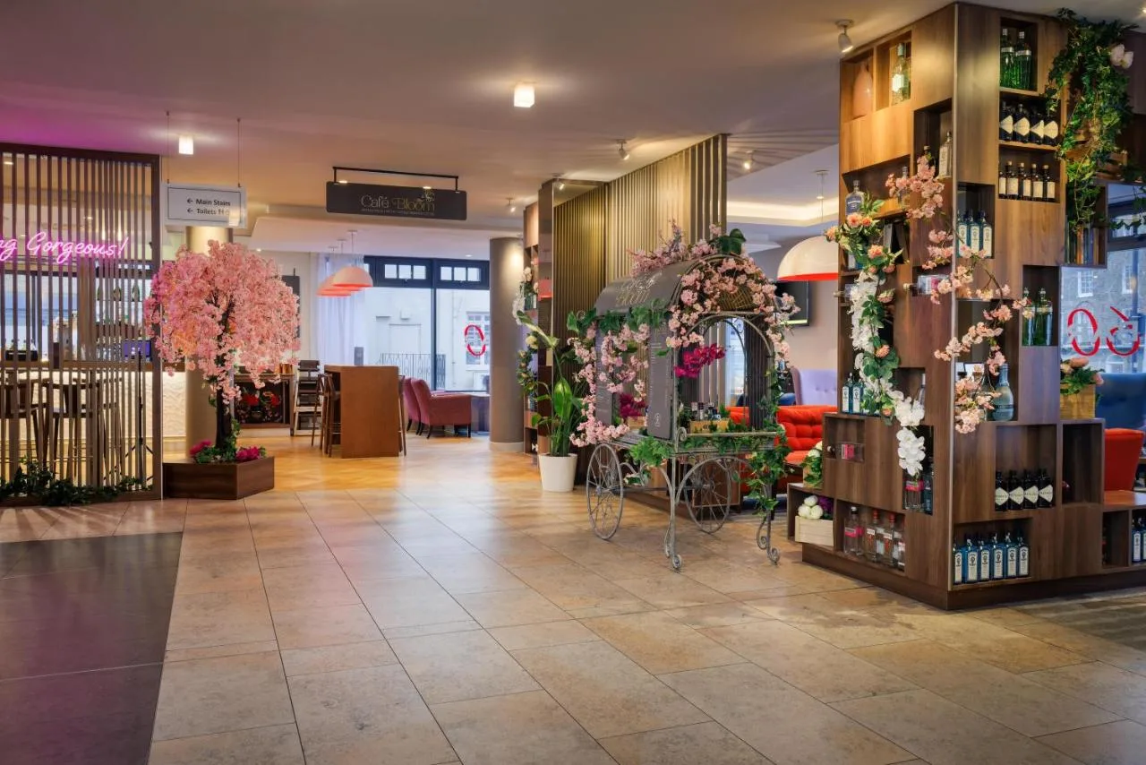 a store with flowers and plants on the walls at DoubleTree by Hilton London Angel Kings Cross in London